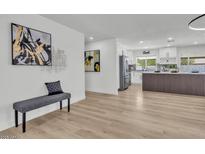 Cozy living space with decor, flowing into the beautifully renovated kitchen and offering comfortable seating at 13215 N 30Th Pl, Phoenix, AZ 85032