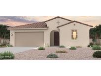 Charming single-story home featuring a well-manicured desert landscape and an attached two-car garage at 18134 W Creedance Blvd, Surprise, AZ 85387