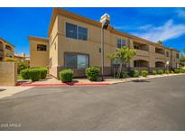 Attractive condo building featuring a stucco exterior and well-maintained landscaping at 2134 E Broadway Rd # 2030, Tempe, AZ 85282