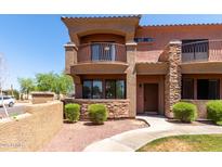 Charming townhome featuring stone accents, a private balcony, and a well-manicured front yard at 21655 N 36Th Ave # 131, Glendale, AZ 85308