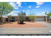 Charming single-story home with desert landscaping and a well-maintained exterior at 3814 E Poinsettia Dr, Phoenix, AZ 85028