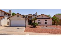 Charming single-story home with a two-car garage, desert landscaping, and basketball hoop in a desirable neighborhood at 4313 E Briarwood Ter, Phoenix, AZ 85048