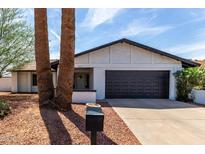 Charming single-story home with a well-maintained front yard and a two-car garage at 4510 N 105Th Ave, Phoenix, AZ 85037