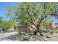 Charming single-story home with desert landscaping and a two car garage at 8438 W Bajada Rd, Peoria, AZ 85383