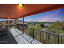 Enjoy Arizona sunsets on this covered balcony with mountain views at 9932 N 16Th E Pl, Phoenix, AZ 85020