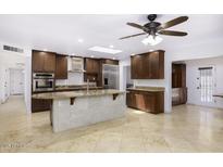 Spacious kitchen with granite counters, stainless appliances and tile flooring throughout at 1059 E Broadmor Dr, Tempe, AZ 85282