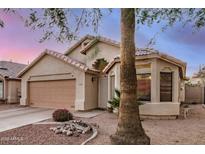 Charming single-story home with a two-car garage and beautiful desert landscaping at 1060 W Dava Dr, Tempe, AZ 85283