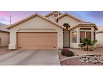 Charming single-story home with a two-car garage and beautiful desert landscaping at 1060 W Dava Dr, Tempe, AZ 85283