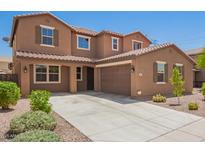 Charming two-story home with a spacious driveway and well-maintained landscaping at 12029 W Overlin Ln, Avondale, AZ 85323
