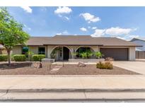 Charming single-story home with a well-manicured front yard and an inviting arched entryway at 2616 S El Dorado --, Mesa, AZ 85202