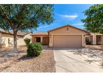 Charming single-story home featuring a two-car garage and low-maintenance desert landscaping at 30212 N Sunray Dr, San Tan Valley, AZ 85143