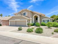 Charming two-story home featuring a three car garage, desert landscaping, and a neutral color scheme at 3921 W Jasper Dr, Chandler, AZ 85226
