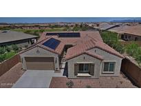 Beautiful single-story home with a two-car garage, solar panels, and low-maintenance desert landscaping at 5490 W Trenton Way, Florence, AZ 85132