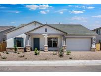 Charming single-story home featuring a stone-accented facade, desert landscaping, and a two-car garage at 8318 W Palo Verde Dr, Glendale, AZ 85305