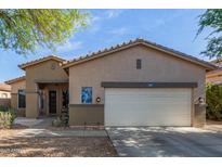 Inviting single-Gathering home featuring a two-car garage and desert landscaping for low maintenance appeal at 839 E Leo Pl, Chandler, AZ 85249