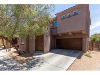 Charming two-story home with a well-manicured front yard and a two-car garage, creating a welcoming curb appeal at 10331 W Devonshire Ave, Phoenix, AZ 85037