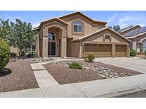 Charming two-story home with stucco exterior, three-car garage, and manicured front yard at 1244 W Straford Ave, Gilbert, AZ 85233
