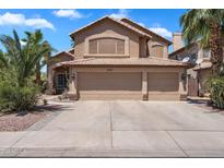 Inviting two-story home featuring a three-car garage and lush landscaping in a vibrant neighborhood at 1264 S Sierra St, Gilbert, AZ 85296