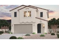 Charming two-story home with stucco siding, tile roof, and a two-car garage at 17223 W Daley Ln, Surprise, AZ 85387