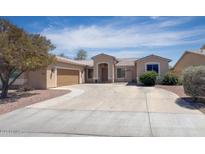 Charming single-story home featuring a circular driveway and well-maintained landscaping at 2041 E Palm Beach Dr, Chandler, AZ 85249