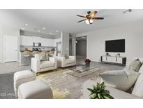 Bright, open living area with modern furnishings and an adjacent kitchen at 29302 N 126Th Ln, Peoria, AZ 85383