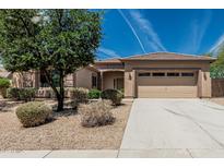 Beautiful single-story home with desert landscaping, a spacious driveway, and a two-car garage at 5232 N 186Th Dr, Litchfield Park, AZ 85340