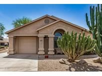 Charming home with a desert-landscaped front yard and a covered entryway at 6621 S Coral Gable Dr, Chandler, AZ 85249