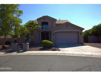 Charming two-story home featuring desert landscaping and a spacious two-car garage at 8920 S 40Th Ln, Laveen, AZ 85339