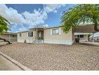 Charming single-story home featuring a covered carport and low maintenance landscaping at 9431 E Coralbell Ave # Ofc, Mesa, AZ 85208