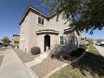 Charming two-story home features an arched entry and manicured landscaping at 1720 W Pollack St, Phoenix, AZ 85041