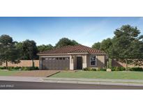 Inviting single-story home with a well-manicured lawn, tiled roof, and a convenient two-car garage at 23361 W Atlanta Ave, Buckeye, AZ 85326