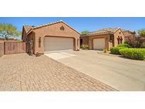 Charming single-story home featuring a two-car garage and a spacious driveway at 2422 W Maya Way, Phoenix, AZ 85085