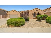 Charming single-story home featuring a two-car garage, desert landscaping, and warm, inviting curb appeal at 2422 W Maya Way, Phoenix, AZ 85085