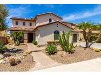 Stunning two-story home featuring desert landscaping with a tiled roof and charming curb appeal at 2460 E Crescent Way, Gilbert, AZ 85298