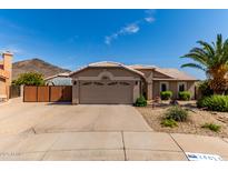 Charming single-story home featuring a well-maintained yard and mountain view at 24813 N 55Th Dr, Glendale, AZ 85310