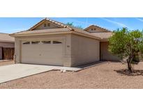Charming single-story home featuring a two-car garage and a well-maintained, low maintenance desert landscape at 330 S Valley Dr, Apache Junction, AZ 85120