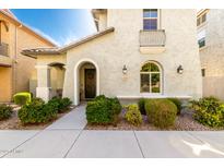 Charming home exterior featuring stucco, arched entry, and well-maintained landscaping at 3910 E Turley St, Gilbert, AZ 85295