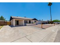 Charming single-story home with well-maintained landscaping and inviting curb appeal on a bright, sunny day at 4325 W Sierra St, Glendale, AZ 85304