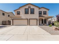 Charming two-story home with a spacious driveway and a two-car garage at 551 E Sun Valley Farms Ln, San Tan Valley, AZ 85140