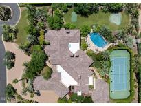 Expansive estate with pool, tennis court, putting green, and lush landscaping at 6624 N 66Th N Pl, Paradise Valley, AZ 85253