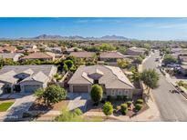 A beautiful single-Gathering home with a well-maintained yard and a stunning view of the mountains in the background at 22323 E Via Del Jardin --, Queen Creek, AZ 85142