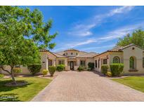 Beautiful single-story home featuring mature landscaping, tiled roof and a spacious driveway at 2457 E Melrose St, Mesa, AZ 85213