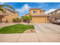Two-story home features a desert landscaped front yard, two-car garage and stone accents at 25806 W Hilton Ave, Buckeye, AZ 85326