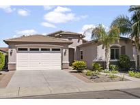 Charming single-story home with a desert landscape, two-car garage, and a beautiful tile roof at 2736 E Sourwood Dr, Gilbert, AZ 85298