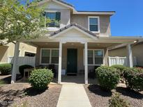 Charming home with a covered front porch, well-manicured landscaping, and inviting curb appeal at 3783 E Stiles Ln, Gilbert, AZ 85295