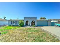 Charming single-story home with a xeriscaped front yard and appealing architectural details at 4201 W Hatcher Rd, Phoenix, AZ 85051