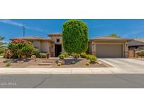 Stunning single-story home featuring desert landscaping, a two-car garage, and a welcoming front entrance at 5085 S Ponderosa Dr, Gilbert, AZ 85298