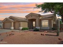 Charming single-story home with a well-manicured desert landscape and neutral color palette at 6781 W Lone Cactus Dr, Glendale, AZ 85308
