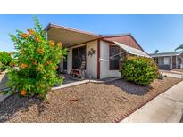 Charming home featuring a cozy covered porch and low-maintenance desert landscaping at 8103 E Southern Ave # 75, Mesa, AZ 85209