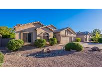 Charming single-story home featuring well-manicured landscaping and a two-car garage at 16333 E Crystal Point Dr, Fountain Hills, AZ 85268